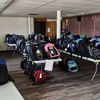 Backpacks filled with school supplies for local children